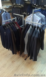 Распродажа оборудования б/у (торговая мебель - стеллажи и стойки) для одежды,  об
